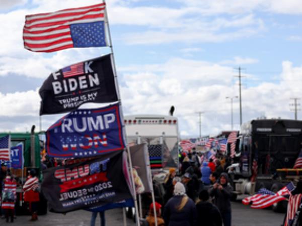 Supporters and truckers gather before a ‘People’s Convoy’ departs for Washington, DC to protest COVID-19 mandates on February 23, 2022 in Adelanto, California.