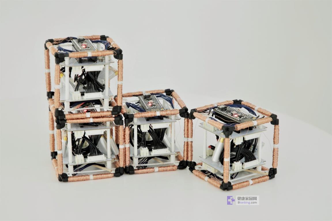 four cubes with copper wires wrapped around their edges that are co<em></em>nnected electromagnetically