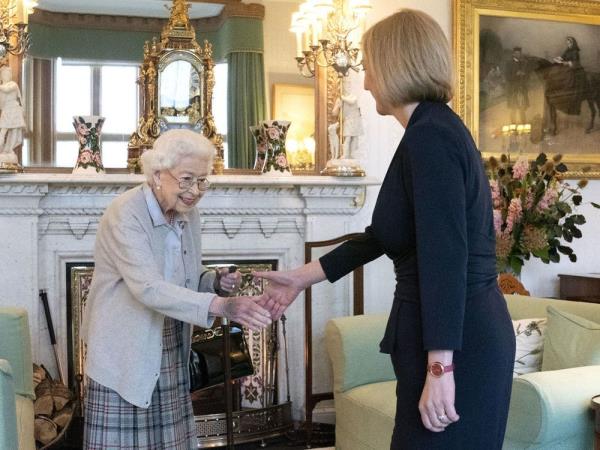 Britain’s Queen Elizabeth II, left, welcomes Liz Truss during an audience at Balmoral, Scotland, wher<em></em>e she invited the newly elected leader of the Co<em></em>nservative party to become Prime Minister and form a new government, Tuesday, Sept. 6, 2022.